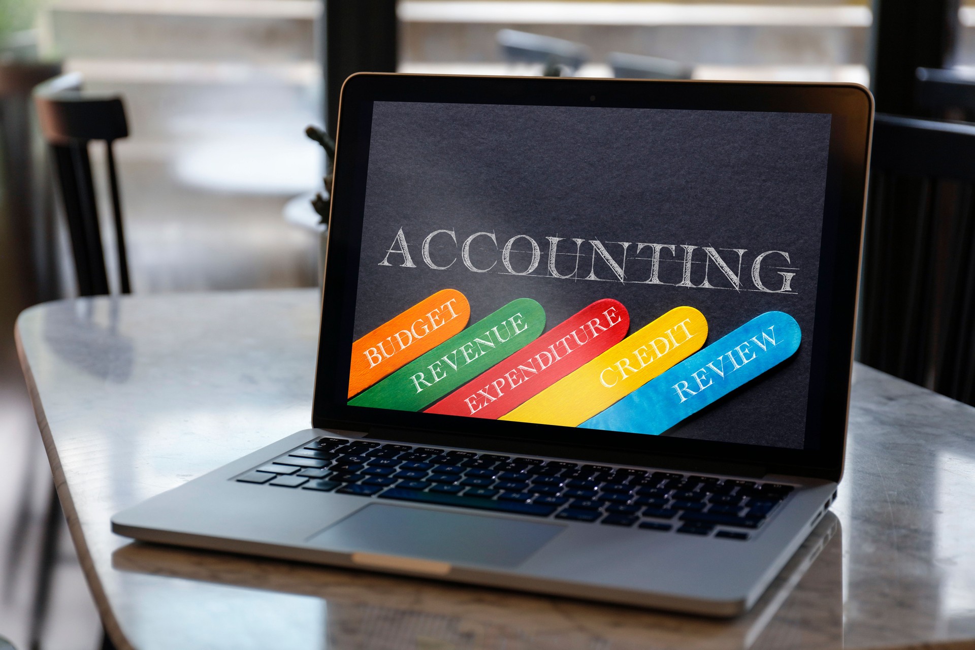 Accounting Concept with Related Keywords on Laptop